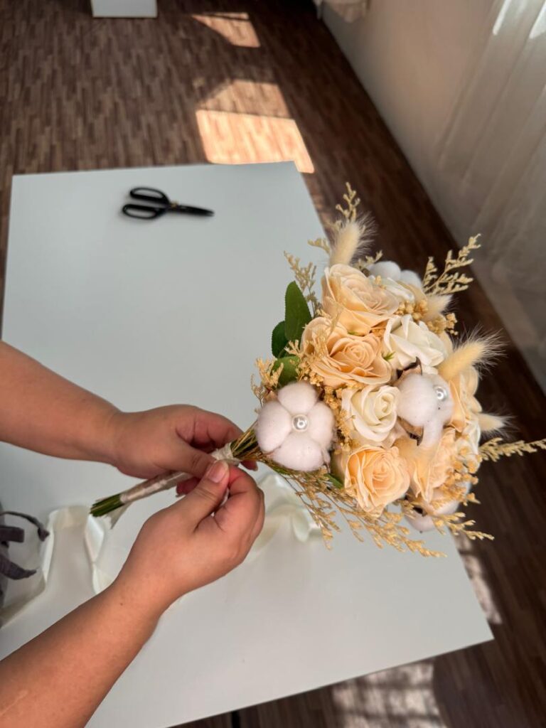 a florist learning how to make soap flower bouquet